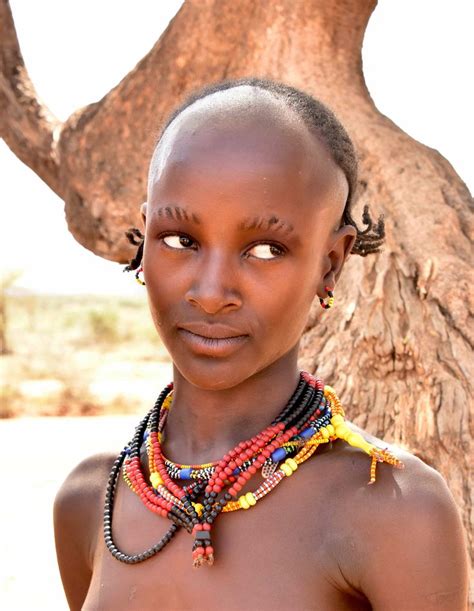 beautiful young woman with luxury makeup, bare shoulders, side view, <b>black</b> background with copy space. . Naked african ladies